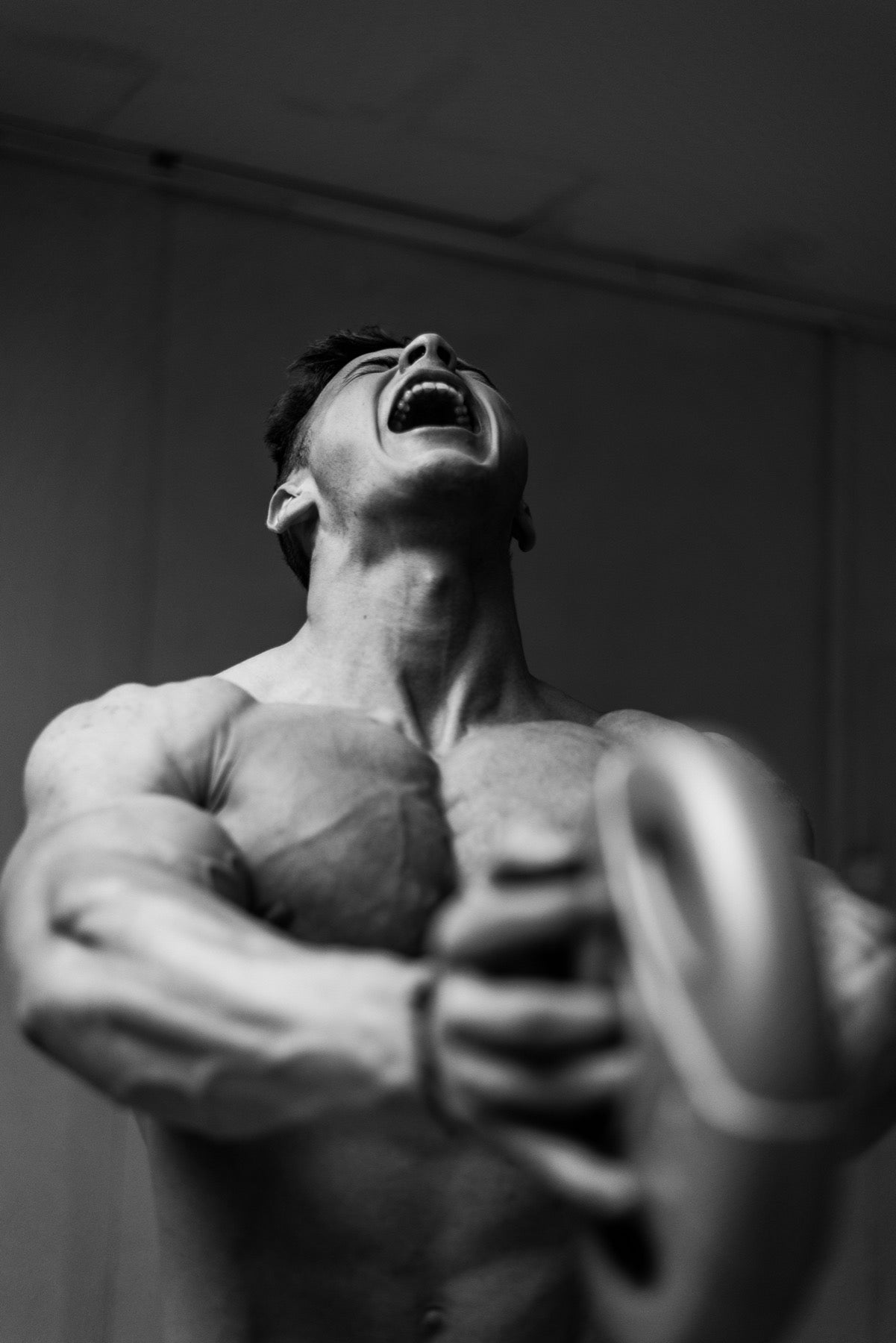 Man lifting a weight plate